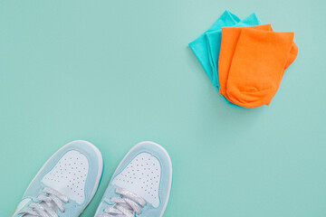 New socks and sneakers. Blue background.