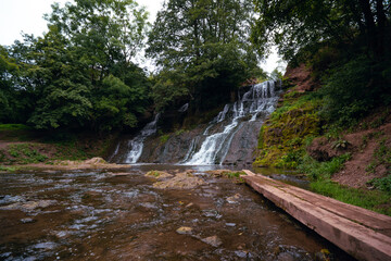 Obraz premium Nature, Chervonogorodsky Falls, Dzhurynsky waterfall in Nyrkiv on the Dzhuryn river. Ternopilska oblast, Ukraine. Tourist place with beautiful views. For recreation and an active lifestyle.