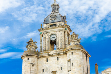 Fototapeta na wymiar Grosse-Horloge tower in La Rochelle, France on a sunny day of summer
