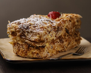 Napoleon puff pastry with cream and strawberries. Shallow depth of field