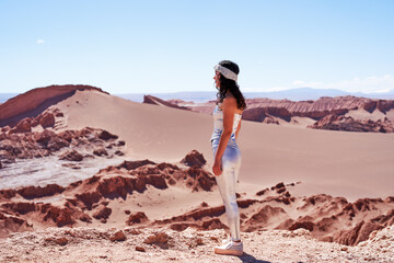 beauty portrait mid adult woman looking at the landscape in the valley of the moon in san pedro de atacama	