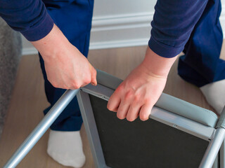 handyman making furniture assembly using tools for repair
