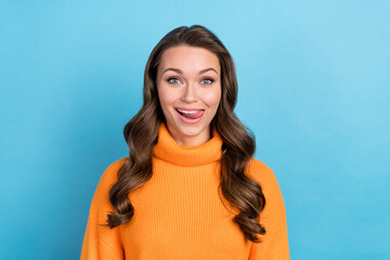 Fototapeta premium Photo funny cute lady lick her lips showing perfect white teeth veneers wear knitwear jumper isolated blue color background