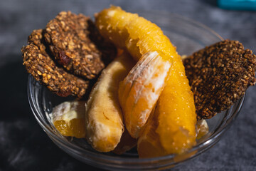 Healthy food, a set of ripe banana, oatmeal cookies and fruit.