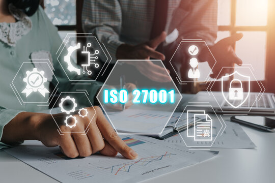 ISO 27001 Quality standards assurance business technology concept, Business team analyzing income charts and graphs with iso 27001 icon on virtual screen.