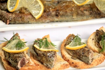 roasted fish river lamprey (lampetra fluviatilis) on a bread