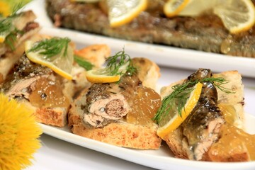 roasted fish river lamprey (lampetra fluviatilis) on a bread