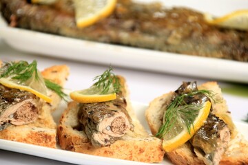 roasted fish river lamprey (lampetra fluviatilis) on a bread