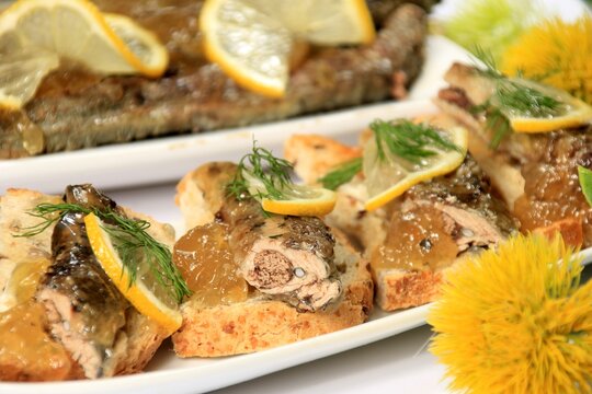 roasted fish river lamprey (lampetra fluviatilis) on a bread