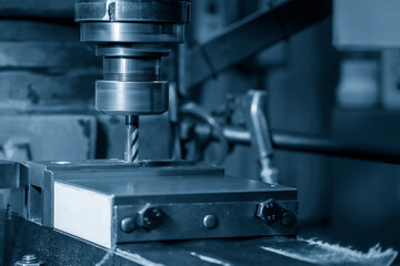 The drilling process on NC milling machine with brass material.