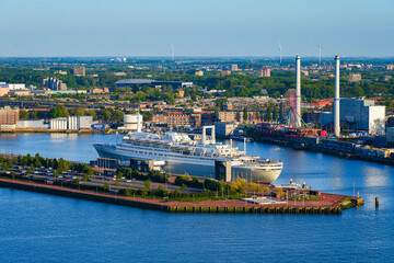Fototapeta premium Aerial view of a large cruise ship moored in the New Meuse river in Rotterdam, the Netherlands