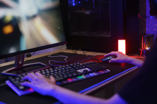 Hand of female cyber hacker gamer on keyboard to playing games or hacking programming system
