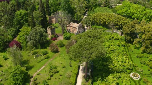 Aerial view of the ruins located in the garden of Ninfa, near Latina, Italy. The park is an Italian natural monument and contains exotic plants from various parts of the world.