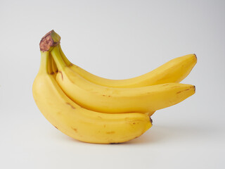 ripe yellow bananas on a white background       