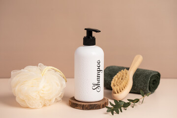 shampoo,  sponge and towel on a light background.