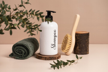 shampoo,  sponge and towel on a light background.