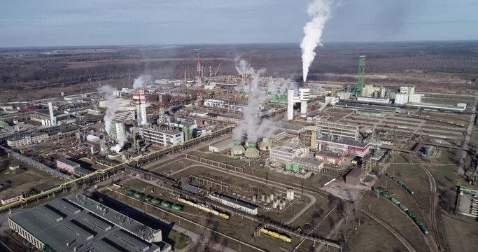 Chemistry Factory in Lithuania, Achema in Jonava City. Clear Blue Sky and Smoke Stacks in Background. Drone