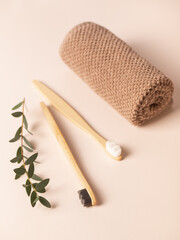 Bamboo toothbrush and towel. Eco-friendly items. Oral care. Biodegradable personal care products.
