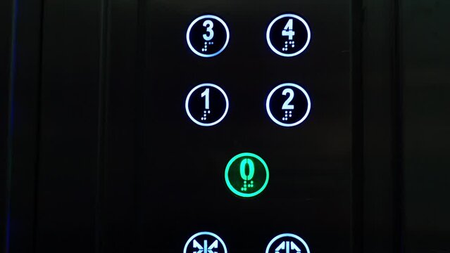 Glowing buttons in the elevator, a red button with the number four, the elevator has arrived.