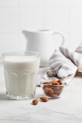 Obraz na płótnie Canvas Almonds, a glass of milk. lactose free milk. Healthy food. Almond milk.