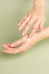 Fototapeta premium Hand cream. Women's hands. Cream on the hands. Skin care.