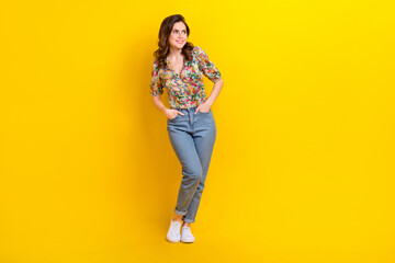 Full body photo cadre of dreaming funky girl wear spring flowers print posing look novelty shopping day isolated on yellow color background