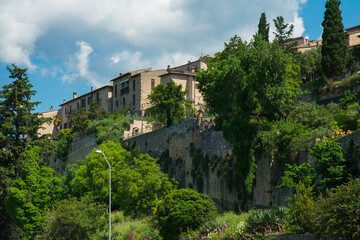 Fototapeta na wymiar Panoramic view of Spello town with green trees in spring season