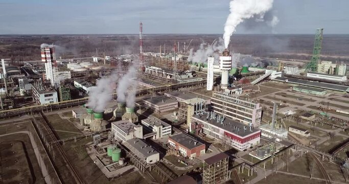Chemistry Factory in Lithuania, Achema in Jonava City. Clear Blue Sky and Smoke Stacks in Background. Drone