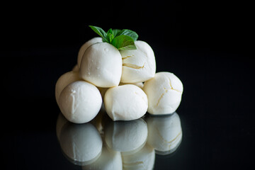 Small balls of traditional mozzarella in a ceramic bowl