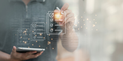 DMS document management system. Assessment form, questionnaire, checklist, and clipboard management. Businessman working on a tablet takes a checklist survey, an online survey.