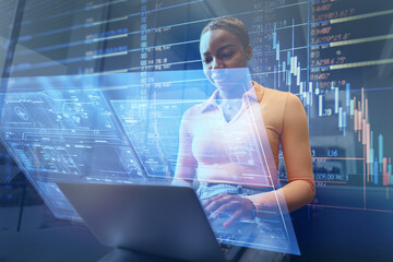 African woman using laptop with hologram interface for business. Innovation, future concept