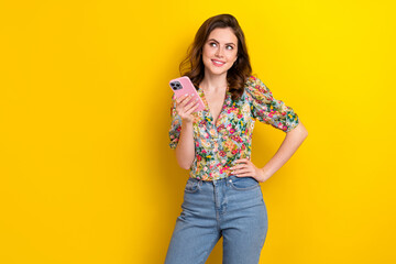Photo of sweet dreamy woman dressed vintage flower print blouse texting modern device empty space...