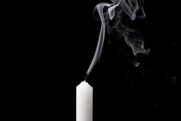 white smoke from an extinguished candle