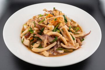 Muk kai kem, Stir Fried Squid with Salted Egg. Thai food.