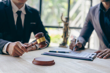 Businessman and male lawyer consulting team meeting with client Legal and legal consultants present...