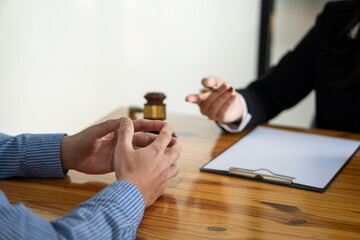 Businessman and male lawyer consulting team meeting with client Legal and legal consultants present contracts signed with clients and legal laws. justice and lawyer concept