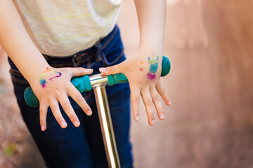 Shimmering sparkling glitter tattoo on a child's hand at a birthday party