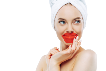 Beautiful woman with smooth skin wears lip mask, minimal makeup & manicure, tries new cosmetic product. Beauty & wellbeing concept