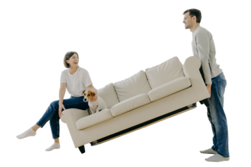 Couple furnishing first home, carrying sofa, playful woman with pet, in living room. Home renovation, real estate, family concept.