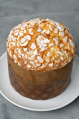 Easter cake with sugar powder on gray background