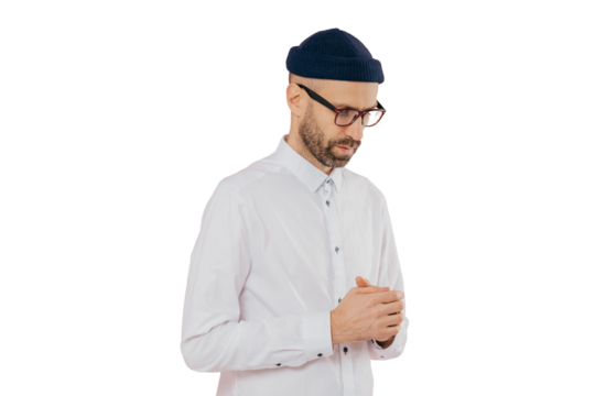 Contemplative man in white shirt, hat & glasses, seeks business solutions. Deep in thought, isolated on white