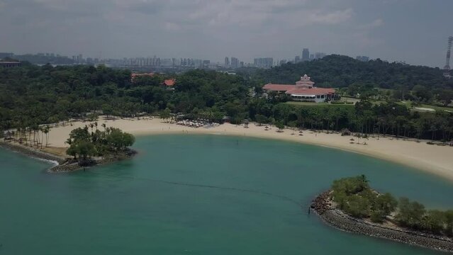 Aerial drone fly over view of Tanjong Beach Sentosa Island - Singapore Circa 2022