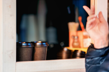 Two paper coffee glass is ready for person takeaway order in street cafe. Outside food service concept.