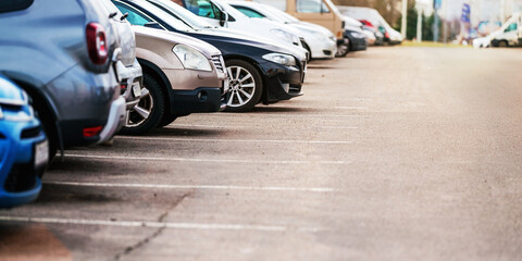 Car parking in asphalt parking lot outdoor at urban street side view. Transportation and environment concept. © Bonsales