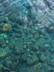 Fototapeta premium Crystal sea water, rocky shoreline