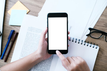 girl using smart phone in office. hand holding smart phone white screen.