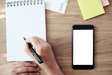 girl using smart phone in office. hand holding smart phone white screen.