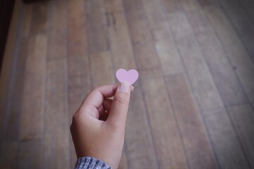 Valentine day love concept. Red Hart in hand with copy space.