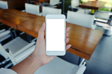 Close up of women's hands holding cell telephone blank copy space screen. smart phone with technology concept.