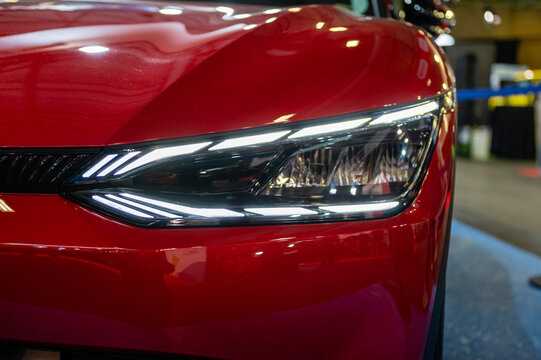 LED headlights and car design closeup of nev KIA EV6, model 2023